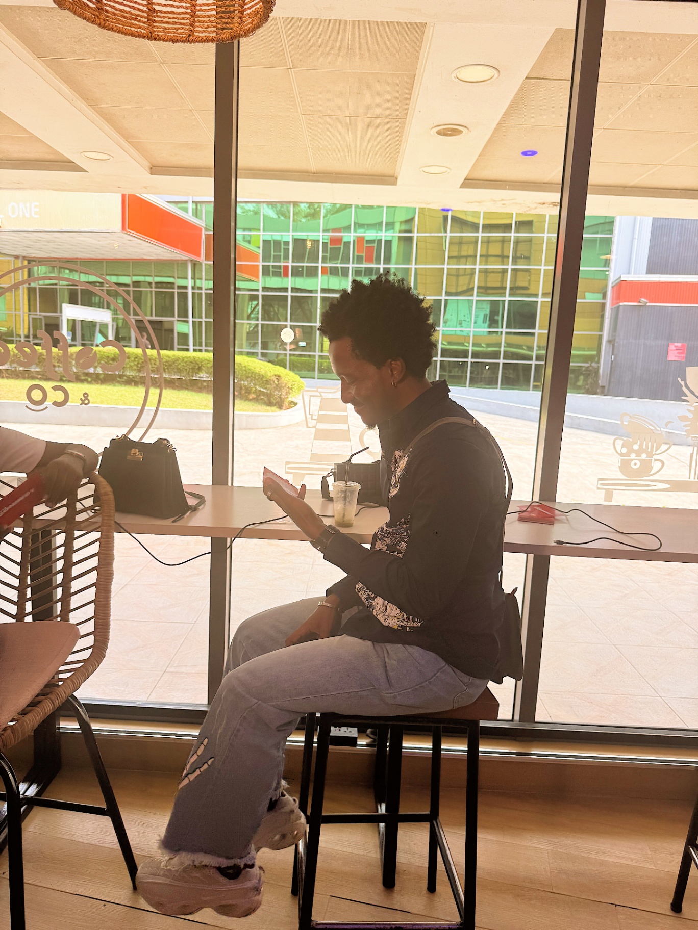 Member enjoying a coffee by the window